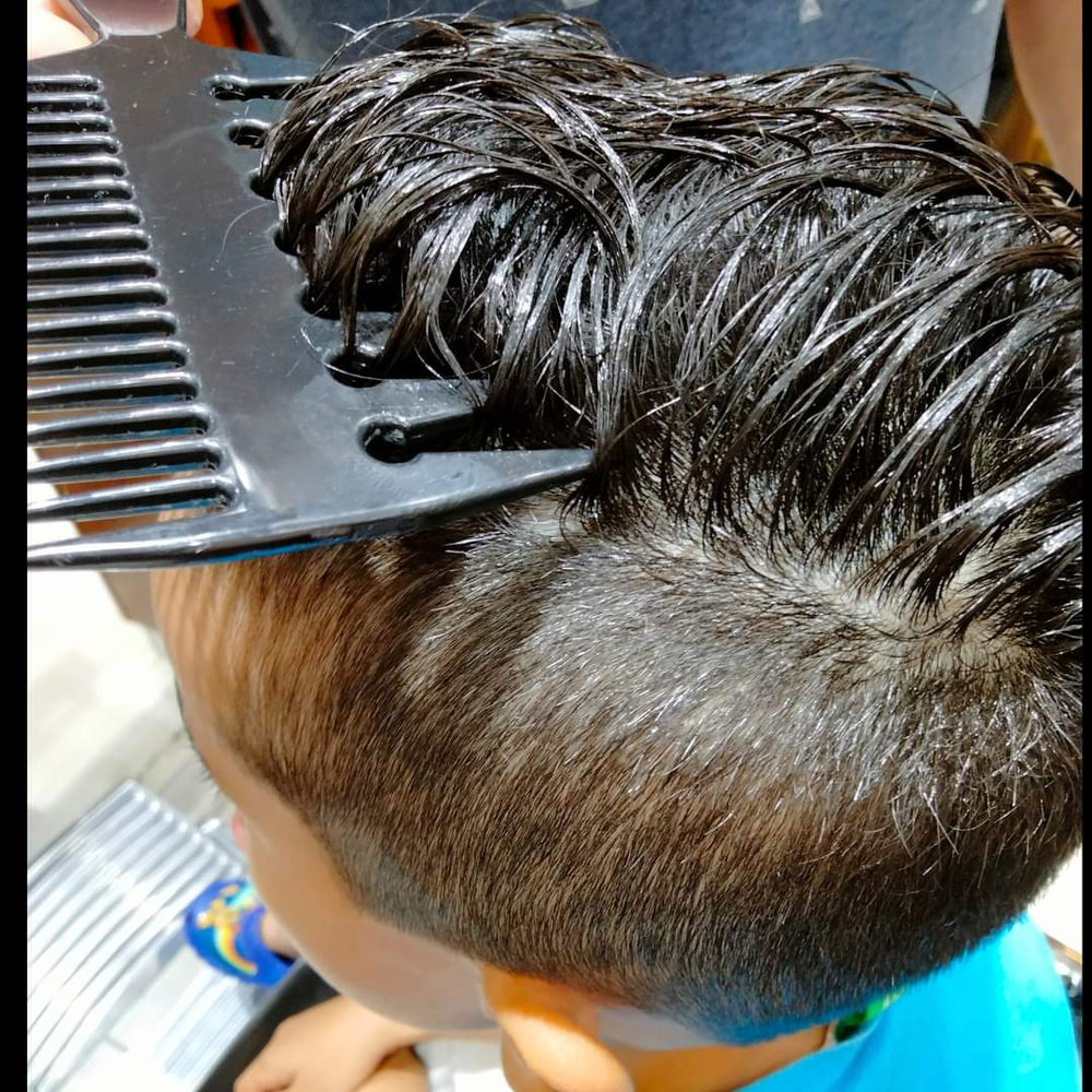 Close-up of a haircut in progress at Hair Beats